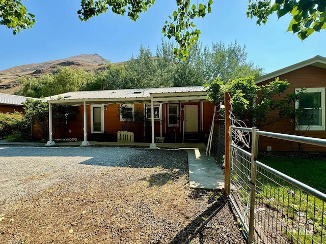 exterior space with covered porch and a mountain view