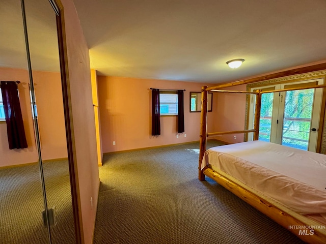 unfurnished bedroom with carpet and french doors