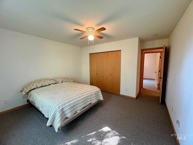 carpeted bedroom with ceiling fan and a closet