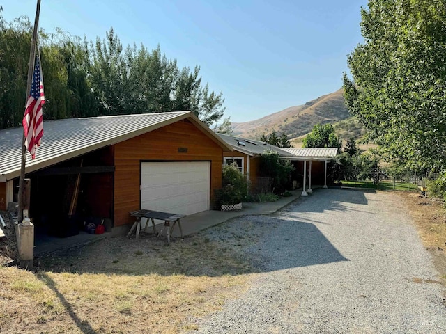 exterior space featuring a mountain view and a garage