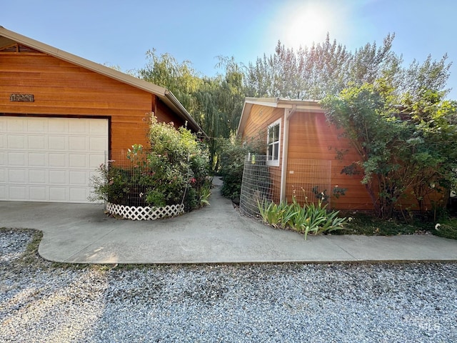 view of side of home with a garage