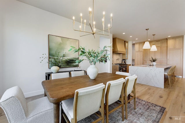 6203 W Estuary St, Eagle, ID 83616 - dining area with light wood finished floors, recessed lighting, baseboards, and a chandelier
