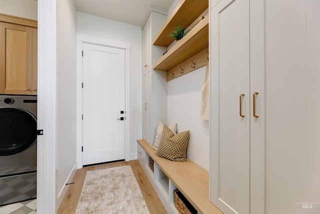 6203 W Estuary St, Eagle, ID 83616 - mudroom with light wood finished floors, washer / clothes dryer, and baseboards