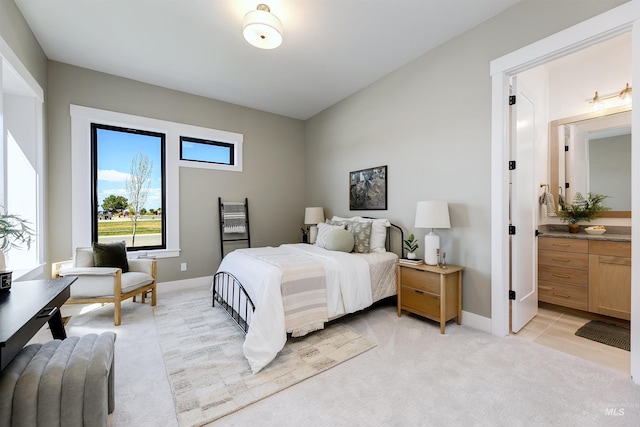 6203 W Estuary St, Eagle, ID 83616 - bedroom with light carpet, connected bathroom, and baseboards