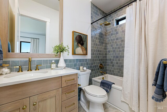 6203 W Estuary St, Eagle, ID 83616 - full bathroom featuring vanity, toilet, shower / bath combo, and tile walls