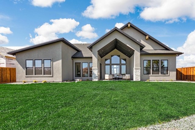6203 W Estuary St, Eagle, ID 83616 - back of house featuring stucco siding, an outdoor living space, and stone siding