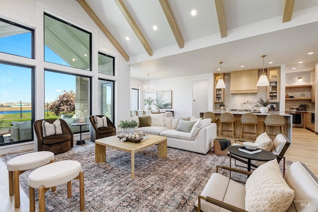 6203 W Estuary St, Eagle, ID 83616 - living area with beamed ceiling, a chandelier, recessed lighting, high vaulted ceiling, and light wood finished floors