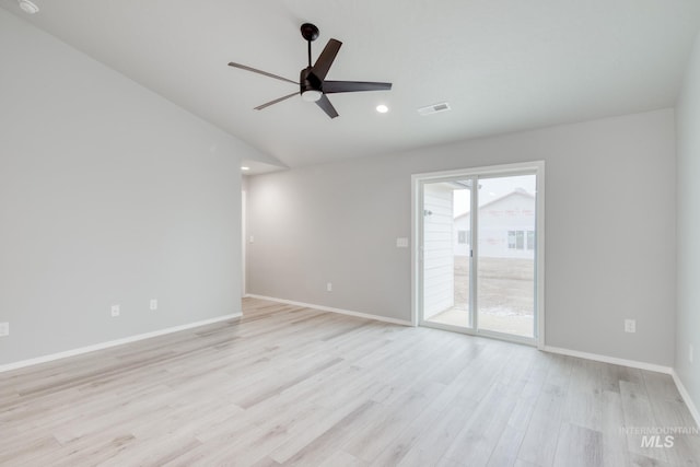 spare room featuring baseboards, visible vents, lofted ceiling, ceiling fan, and light wood-type flooring