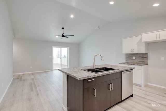 kitchen featuring ceiling fan, a center island with sink, dishwasher, white cabinets, and a sink