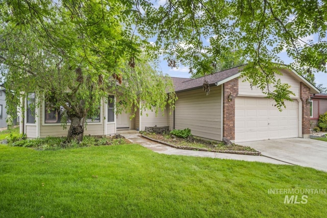 view of front of property with a garage and a front yard