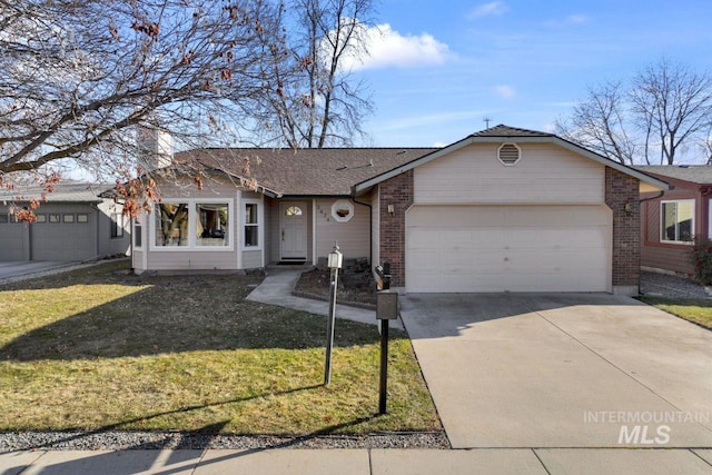 single story home featuring a garage and a front yard