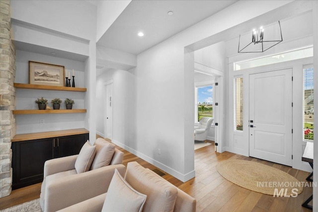 8848 Overunder Ln, Middleton, ID 83644 - foyer with wood-type flooring, a chandelier, baseboards, and recessed lighting
