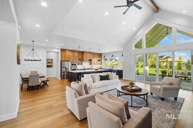 8848 Overunder Ln, Middleton, ID 83644 - living room with a chandelier, light wood-style floors, recessed lighting, a ceiling fan, and baseboards