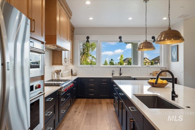 8848 Overunder Ln, Middleton, ID 83644 - kitchen with appliances with stainless steel finishes, a sink, light countertops, and recessed lighting
