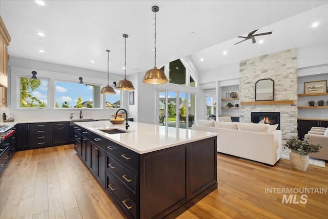 8848 Overunder Ln, Middleton, ID 83644 - kitchen featuring a sink, light countertops, light wood-style floors, ceiling fan, and recessed lighting