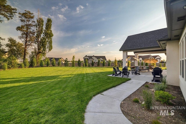 8848 Overunder Ln, Middleton, ID 83644 - yard at dusk featuring a patio and a yard