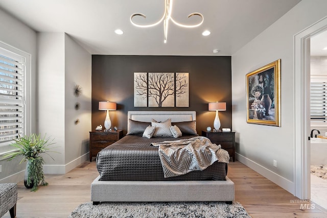 bedroom featuring recessed lighting, light wood-type flooring, and baseboards