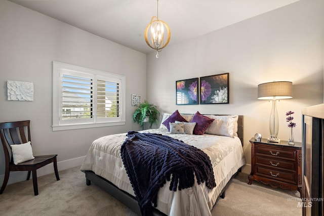 bedroom with light carpet, a notable chandelier, and baseboards