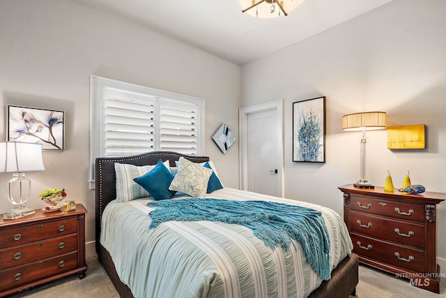 bedroom featuring carpet