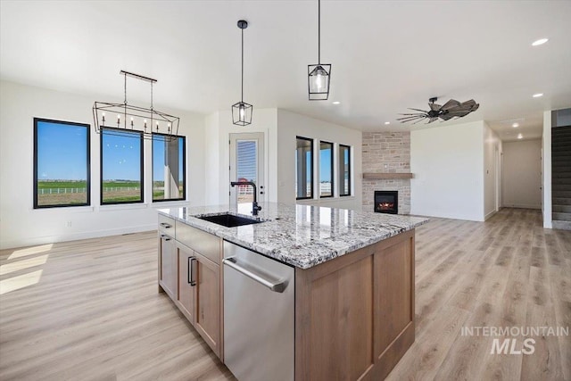 4069N 2200 2200 E E, Filer, ID 83328 - kitchen with a sink, light wood-style floors, stainless steel dishwasher, recessed lighting, and light stone countertops