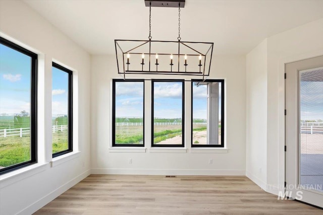 4069N 2200 2200 E E, Filer, ID 83328 - unfurnished dining area featuring plenty of natural light and light wood-type flooring