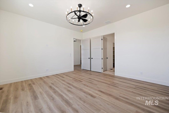 4069N 2200 2200 E E, Filer, ID 83328 - unfurnished room with a chandelier, baseboards, light wood-type flooring, and recessed lighting
