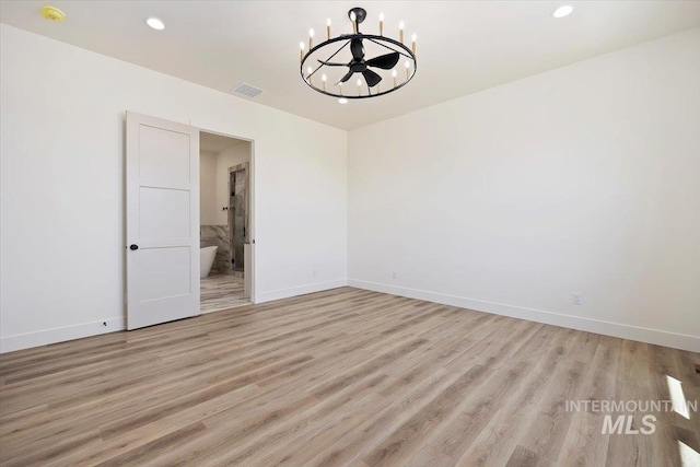 4069N 2200 2200 E E, Filer, ID 83328 - spare room featuring a chandelier, light wood-style flooring, baseboards, recessed lighting, and a smoke detector