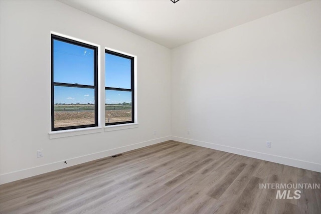 4069N 2200 2200 E E, Filer, ID 83328 - empty room featuring wood finished floors and baseboards