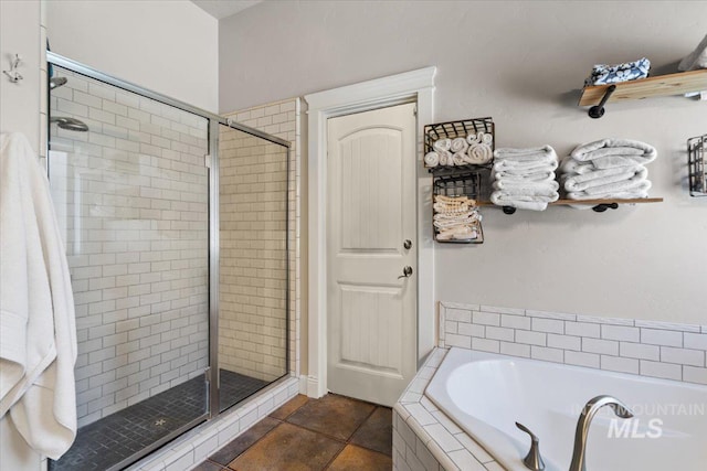 bathroom featuring separate shower and tub and tile patterned floors