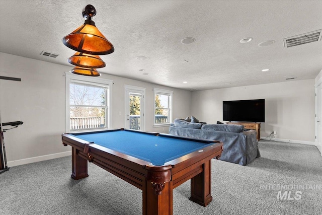 game room featuring billiards, carpet, and a textured ceiling