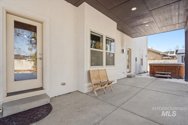 view of patio featuring a hot tub