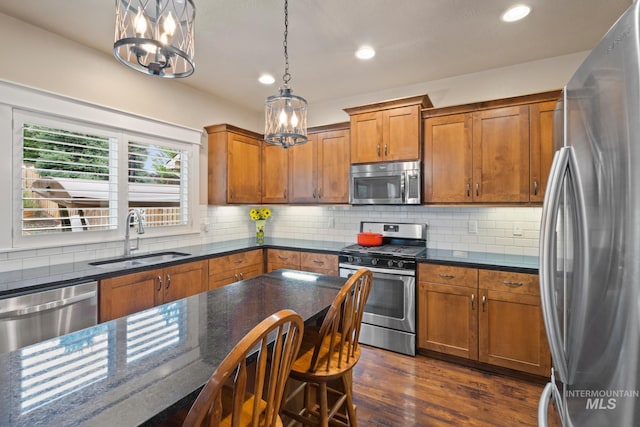 9462 W Whitecrest, Star, ID 83669 - kitchen with stainless steel appliances, a chandelier, brown cabinets, and recessed lighting
