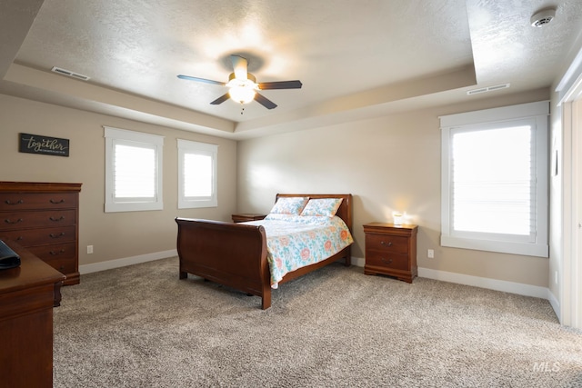 9462 W Whitecrest, Star, ID 83669 - carpeted bedroom featuring a raised ceiling, ceiling fan, and a textured ceiling