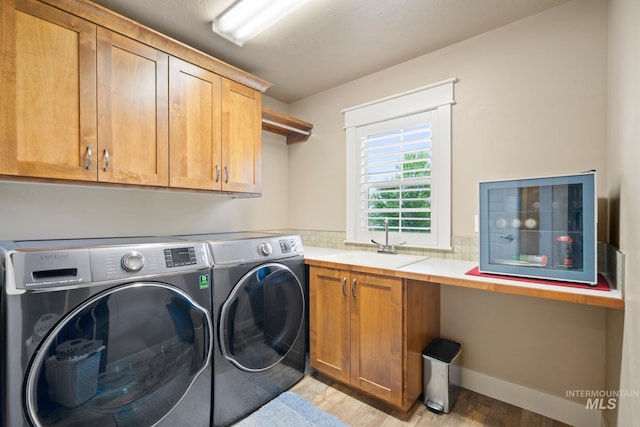 9462 W Whitecrest, Star, ID 83669 - washroom with cabinet space, separate washer and dryer, and light wood-style flooring