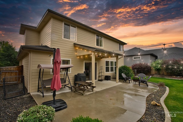 9462 W Whitecrest, Star, ID 83669 - back of property at dusk with a patio and a fenced backyard