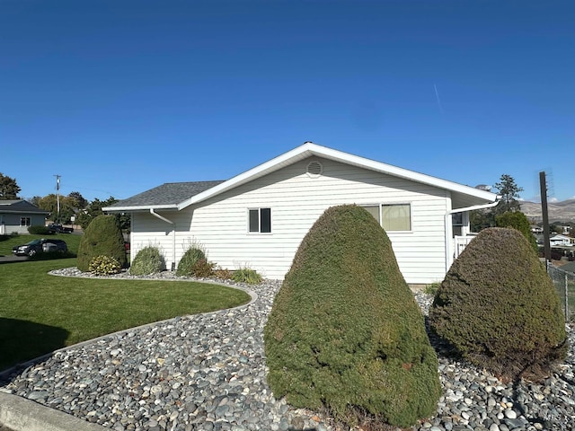 view of home's exterior featuring a yard