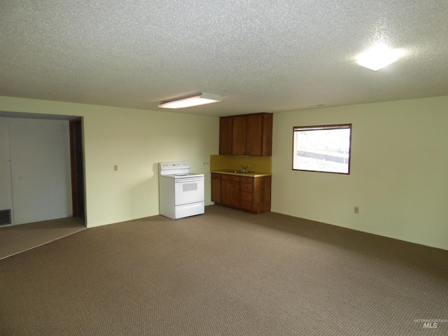 interior space with a textured ceiling, white electric stove, light colored carpet, and sink