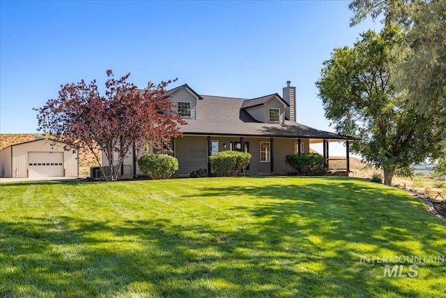 1006 Hill Rd, Homedale, ID 83628 - view of front of house featuring a chimney, a detached garage, and a front yard