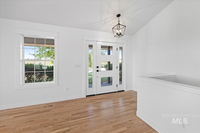 1006 Hill Rd, Homedale, ID 83628 - foyer entrance featuring light wood-style floors and a chandelier