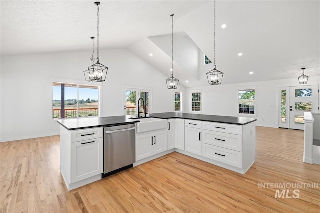 1006 Hill Rd, Homedale, ID 83628 - kitchen featuring dishwasher, dark countertops, light wood-style flooring, recessed lighting, and white cabinetry