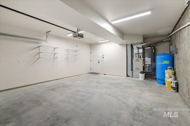1006 Hill Rd, Homedale, ID 83628 - garage featuring water heater, a garage door opener, and heating unit