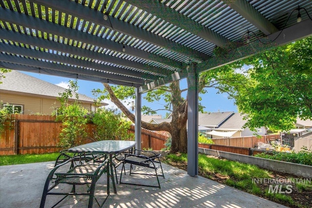 583 E Willowridge Ct, Kuna, ID 83634 - fenced backyard featuring outdoor dining space, a patio area, and a pergola