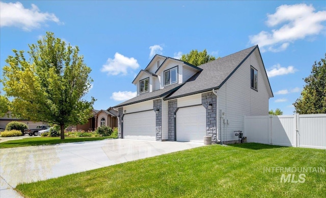 583 E Willowridge Ct, Kuna, ID 83634 - view of front of property featuring concrete driveway, stone siding, a garage, and a gate
