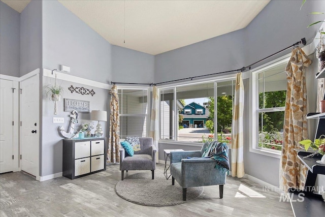 583 E Willowridge Ct, Kuna, ID 83634 - sitting room with wood finished floors, baseboards, and a high ceiling