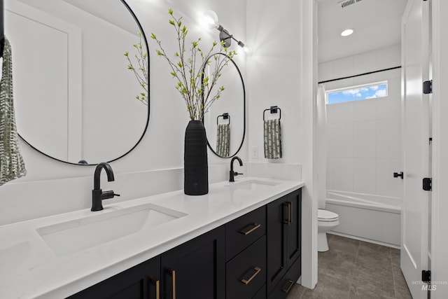 13684 N Sage Grouse Pl, Boise, ID 83714 - bathroom with double vanity, shower / washtub combination, toilet, and a sink