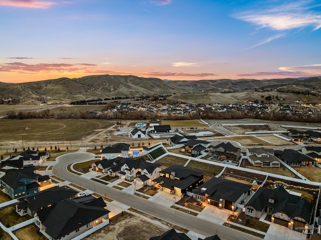 13684 N Sage Grouse Pl, Boise, ID 83714 - aerial view at dusk featuring a residential view and a mountain view