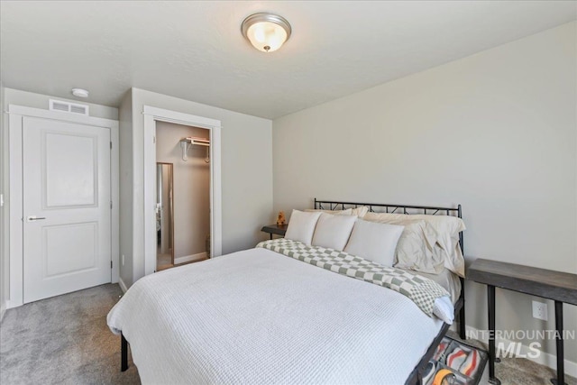 bedroom featuring carpet floors, baseboards, and visible vents