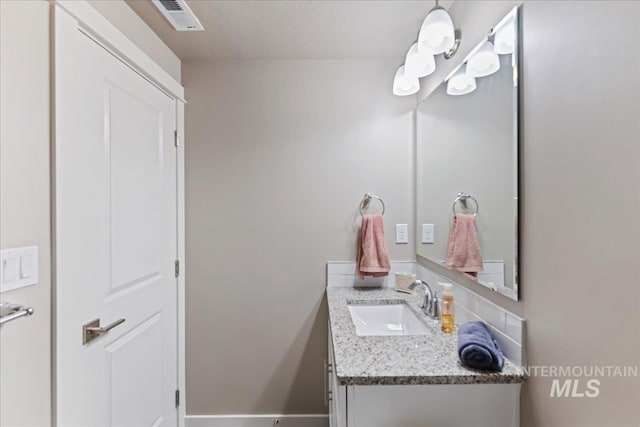 bathroom featuring visible vents and vanity