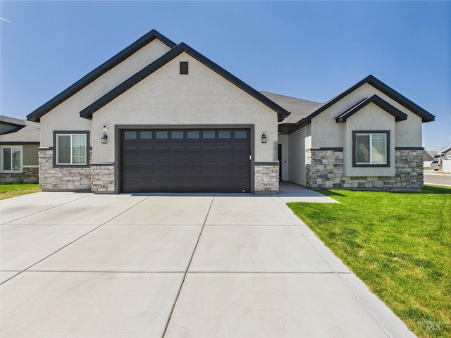 2420 Great Basin Way, Burley, ID 83318 - view of front of home featuring stone siding, an attached garage, stucco siding, and concrete driveway
