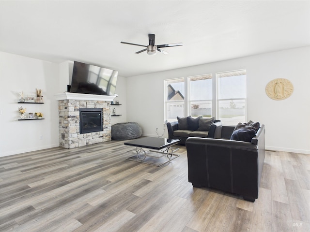 2420 Great Basin Way, Burley, ID 83318 - living area featuring ceiling fan, wood finished floors, a fireplace, and baseboards